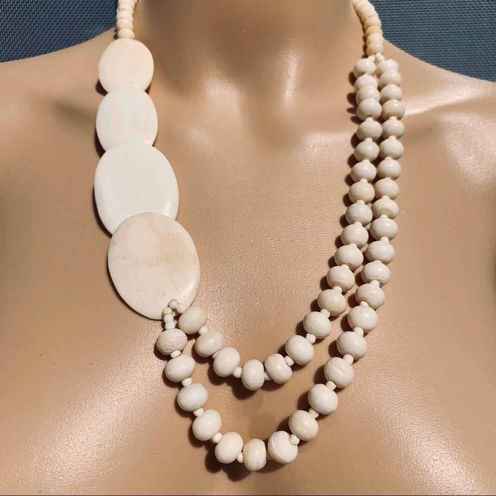 Beautiful bone plate and bead 24 inch necklace.